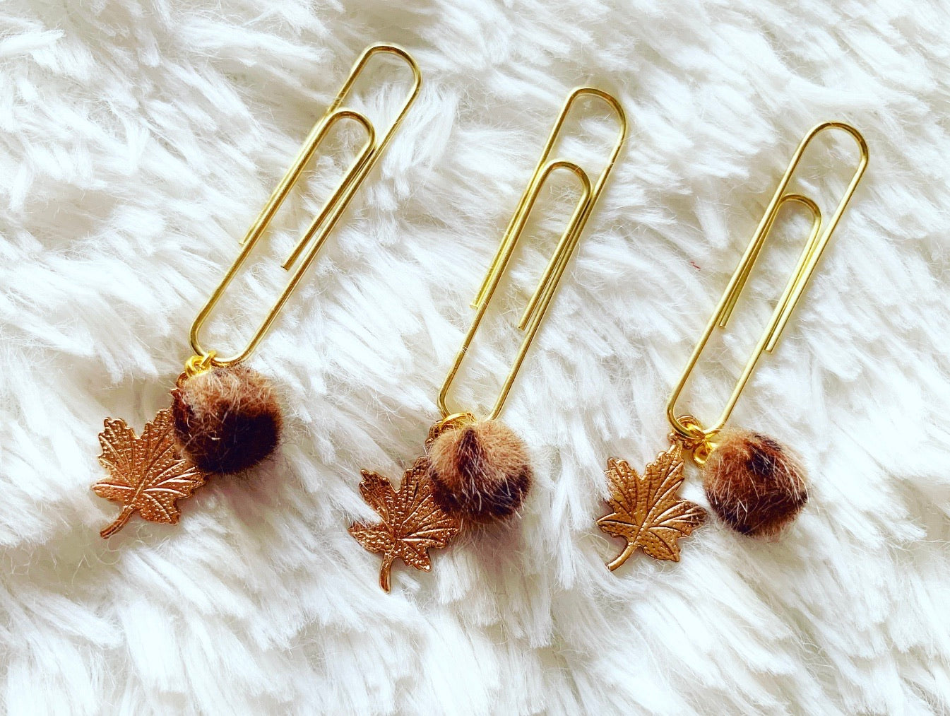leopard print PomPom with leaf dangle clip